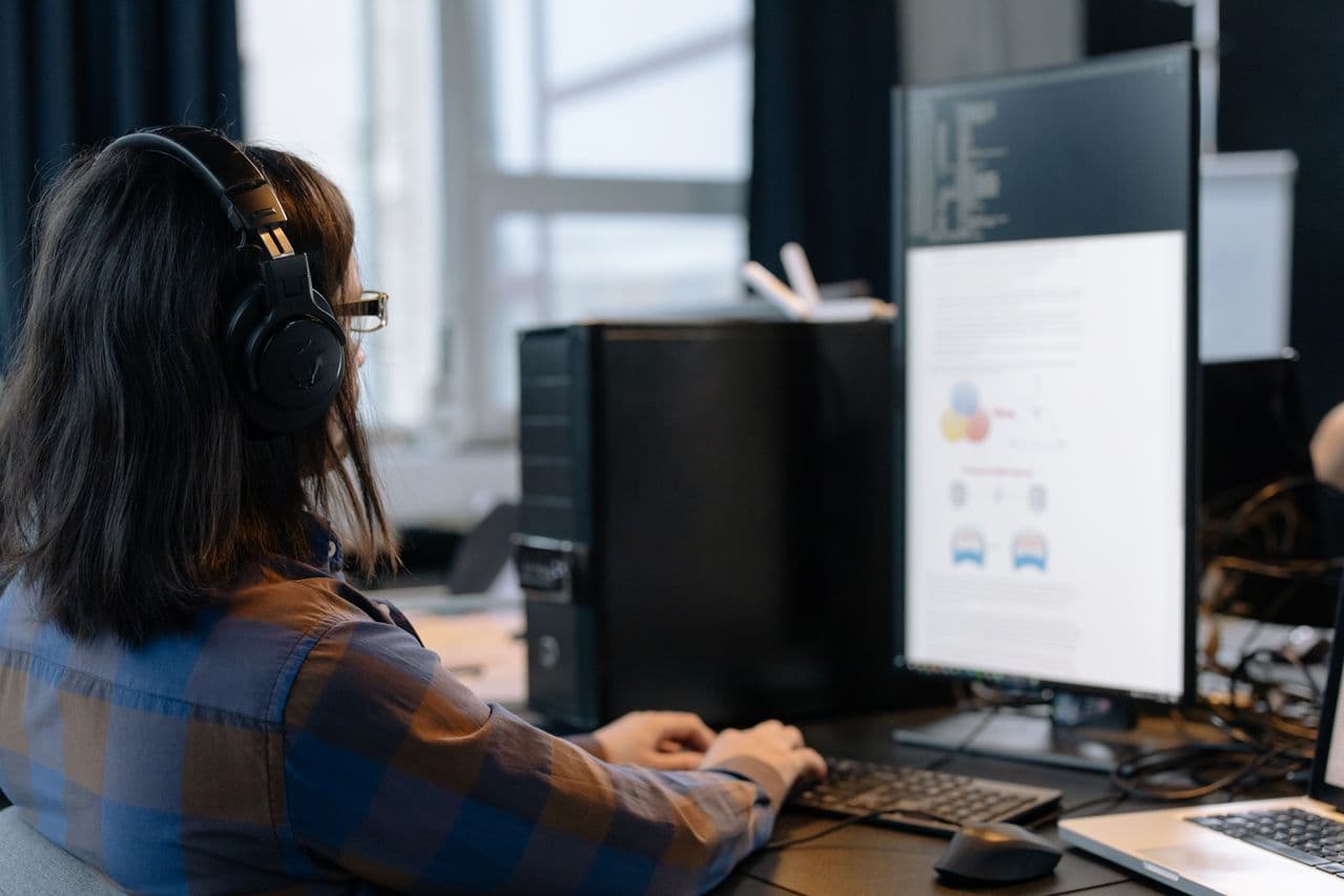 Technician working through a digital case at a workstation